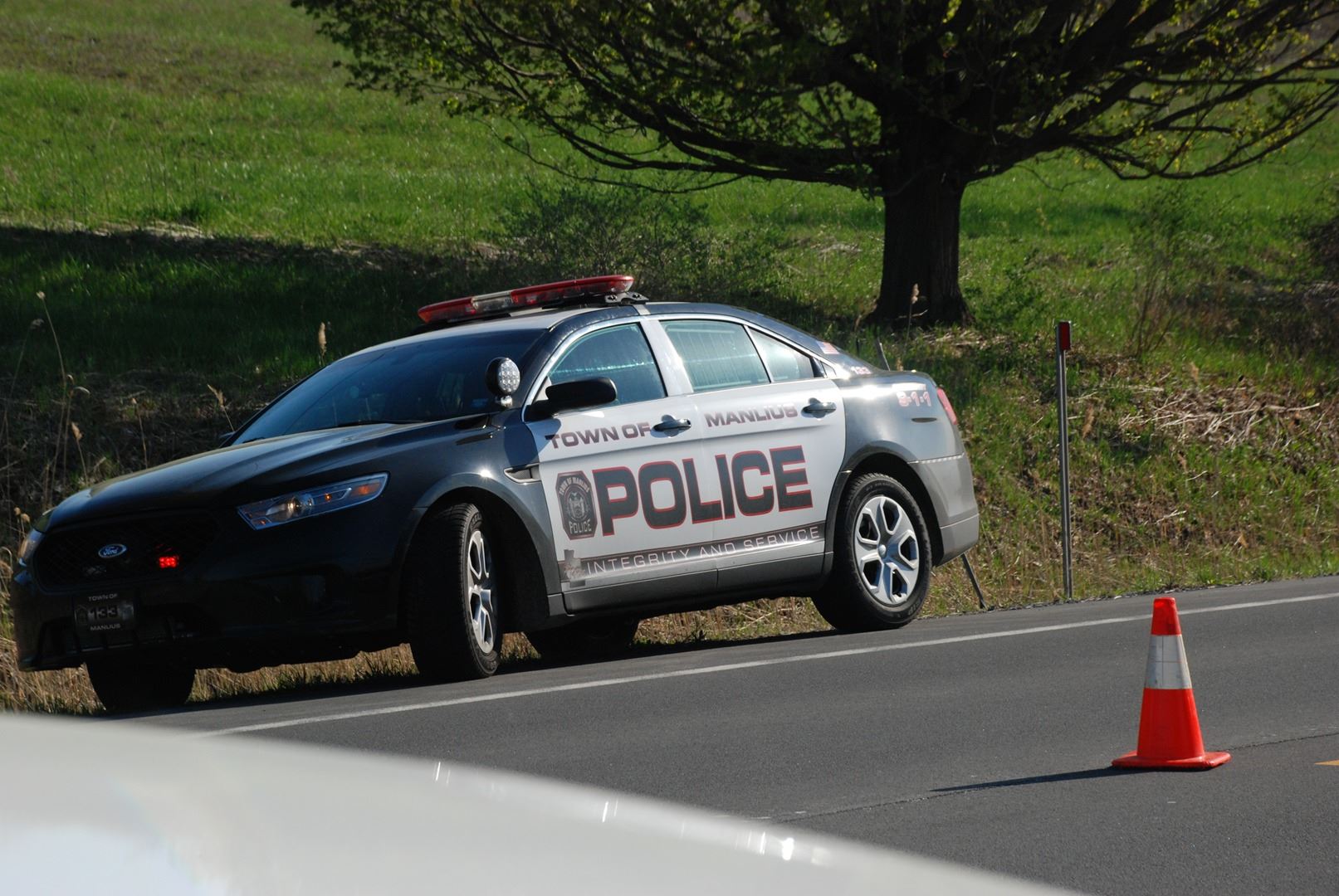 A police car parked on the side of the road
